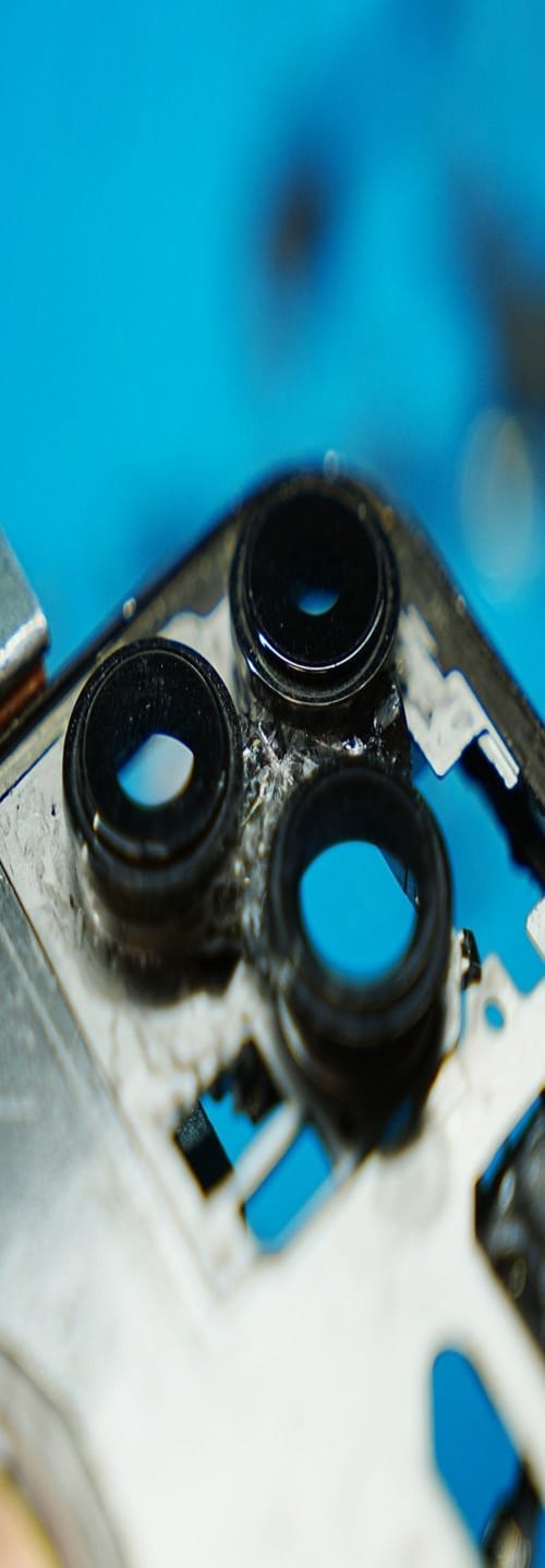 Technician repairing iPhone camera in Ocala