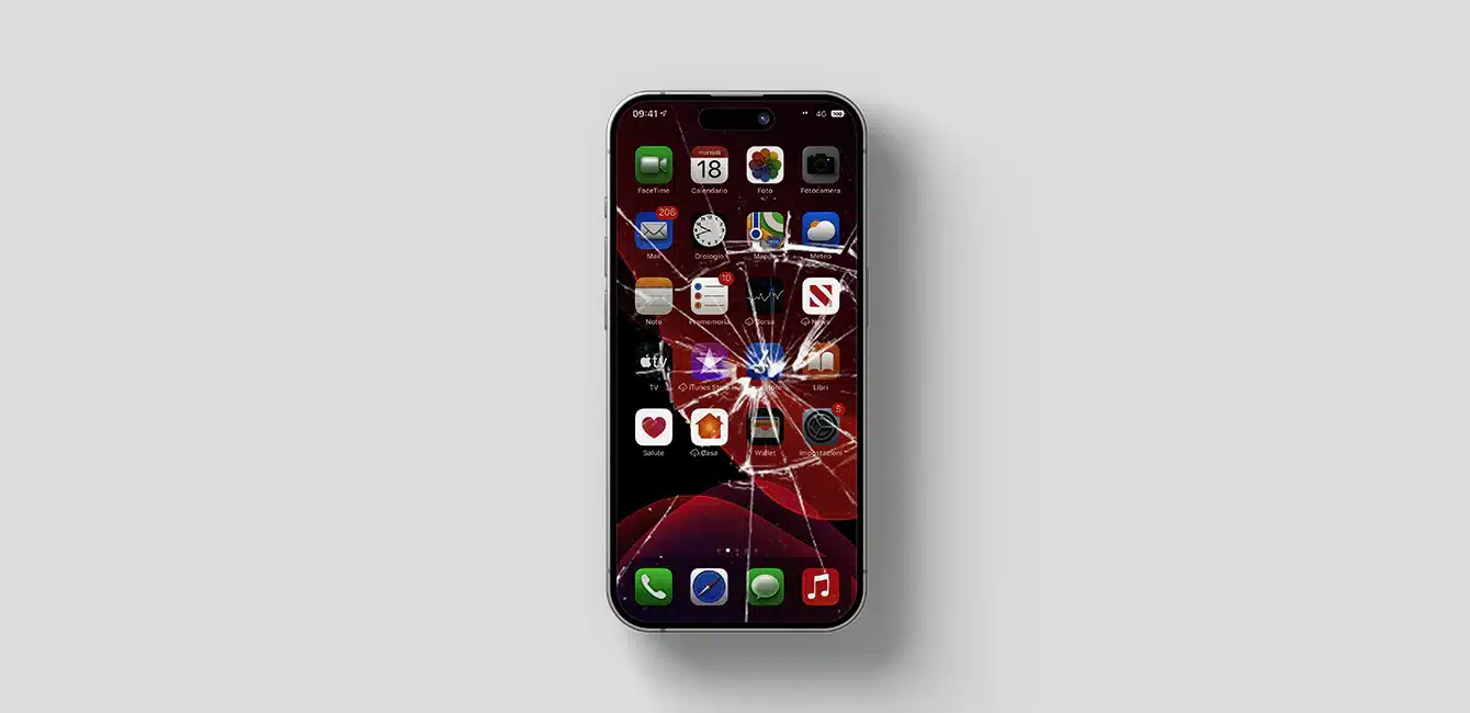 Smartphone with a severely cracked screen displaying home screen icons